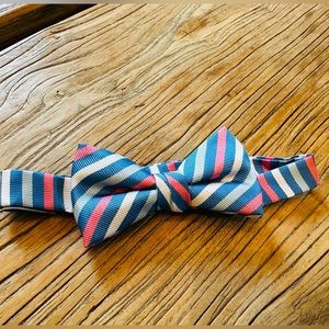 J Crew boys bow tie. Coral, blue, white stripes. Worn once. Adjustable.